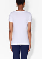 Model wears white short sleeve v-neck t-shirt in pima cotton.