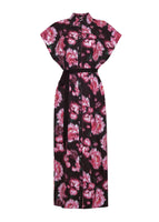 A flat lay of the front of the Shirt Dress in Printed Poplin in black with a pink floral design. The dress is ankle-length, short sleeved and belted with buttons from the collar to the bottom hem.
