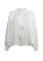A flat lay of the front of the ivory Blouse with Pearls in Silk Charmeuse.