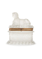 A cased crystal box with sphinx lid and gold detailing.