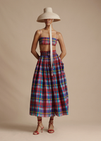 Full shot of model wearing the Taiko Hat, Bandeau in Printed Tussah Silk, and Lovisa Skirt with Smocked Waist in Printed Voile.