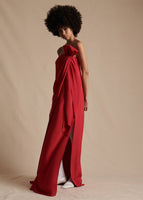 Model is wearing the red Bustier Dress in silk Crepe. Photo shows the side cut-out on the dress.