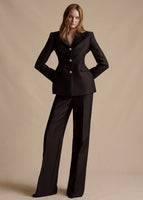 Model is wearing the Radzimir Wool Blazer with Swarovski crystal buttons, paired with the matching Bettina Pant in silk wool.