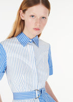 A close up of a model wearing leighton dress in stripe shirting