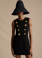 A close up of the Mini Aubrey Dress in Wool Crepe, paired with the Cleo Hat.