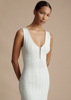 A close up of the model wearing the Mysa Dress in Ladder Knit in White.