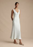 A model wearing the Mysa Dress in Ladder Knit in White.