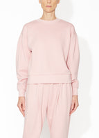 A front view of a blush sweatshirt.