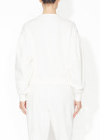 A back view of a ivory sweatshirt.