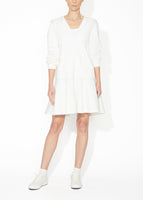 A front view of an ivory hooded zip up dress.