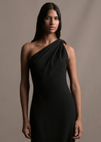 A zoomed in image of a model wearing a black satin one shoulder gown with wrap ribbon detail.
