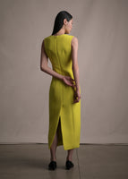 A model standing backwards wearing a yellow sleeveless mid-calf dress.