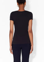 Model wears black short sleeve v-neck t-shirt in pima cotton.