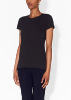 Model wears a black short sleeve crewneck t-shirt in pima cotton