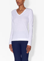 Model is wearing a white long sleeve v-neck t-shirt in pima cotton.