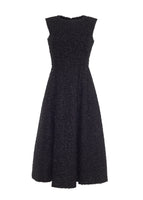 Flat lay of a mid length black metallic fit and flare dress in metallic tweed.