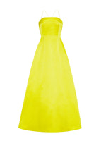 Flat lay of a laceback citrine floor length gown in duchess satin with spaghetti straps.