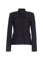 Flat lay of a black mid length metallic tweed jacket with pockets and crystal buttons across the front.