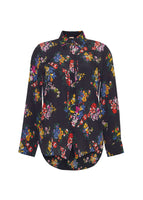 Flat lay of black long sleeve shirt with collar, thin bow, and multicolor printed flowers in crepe de chine.