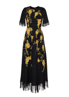 A flat lay of the front of the Eloise Dress in Lino Weave in black with yellow floral embroidery.