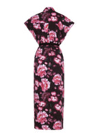 A flat lay of the back of the Shirt Dress in Printed Poplin in black with a pink floral design. The dress is ankle-length, short sleeved and belted with buttons from the collar to the bottom hem.