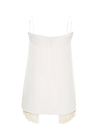 A flat lay of the back of the ivory Cami Top with Fringe in Silk Crepe.