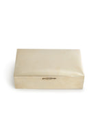A silver box in front of a white background.