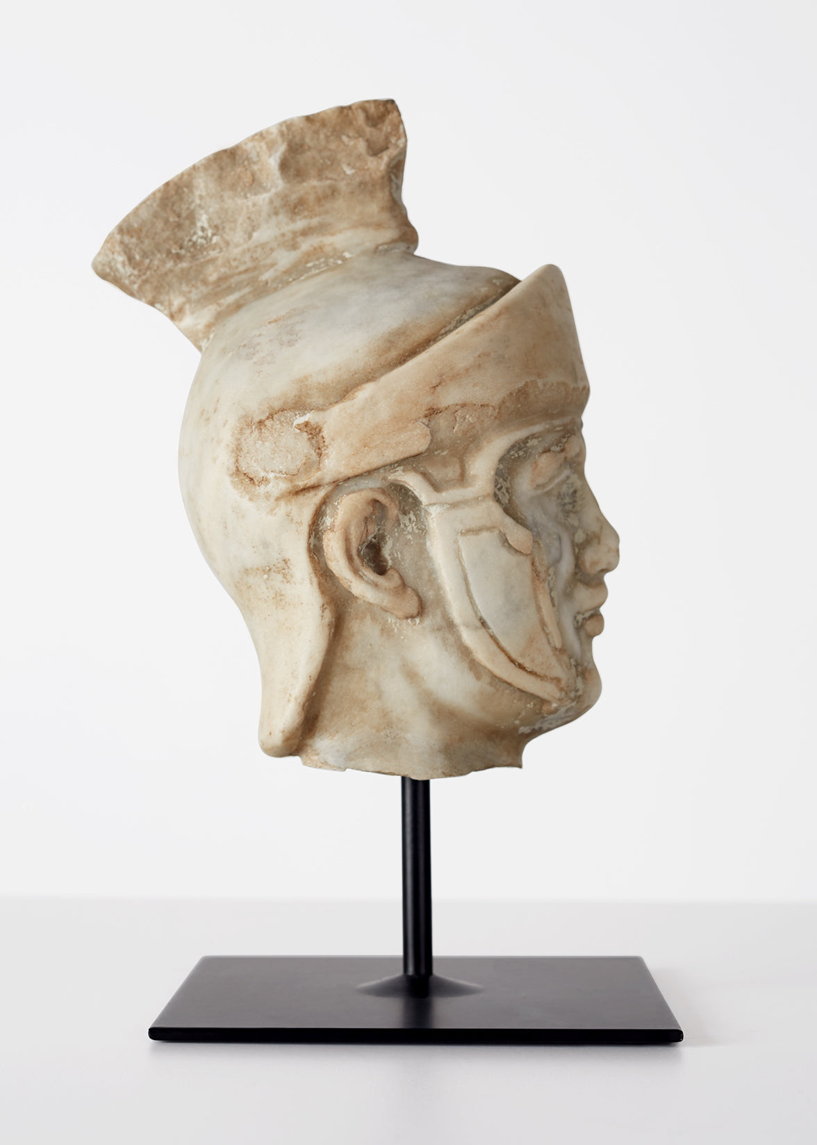 Grand tour model of a small head of a Roman soldier. Carved of Carrera marble, Italy. C. 19th century.