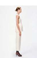 side view of model wearing the perry skirt in toile de laine in ivory