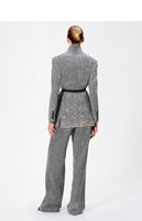 back image of the model wearing the herringbone blazer