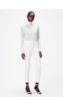 model wearing the cigarette pant in white in stretch cady