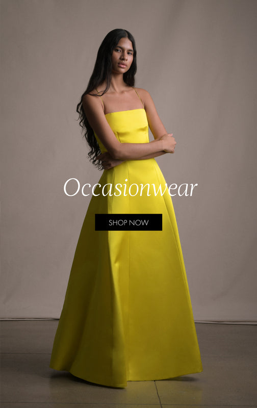 Occasionwear. Shop Now. An image of a model wearing a strapless yellow long gown.