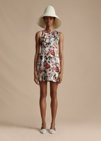 A model wearing the Sheath Dress in Printed Cotton Twill, paired with the Cleo Hat.