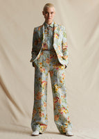 Image of a model facing forward wearing a pale blue floral suit and matching shirt.
