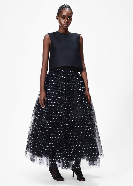 model wearing the fumee skirt in embroidered tullle by Adam Lippes