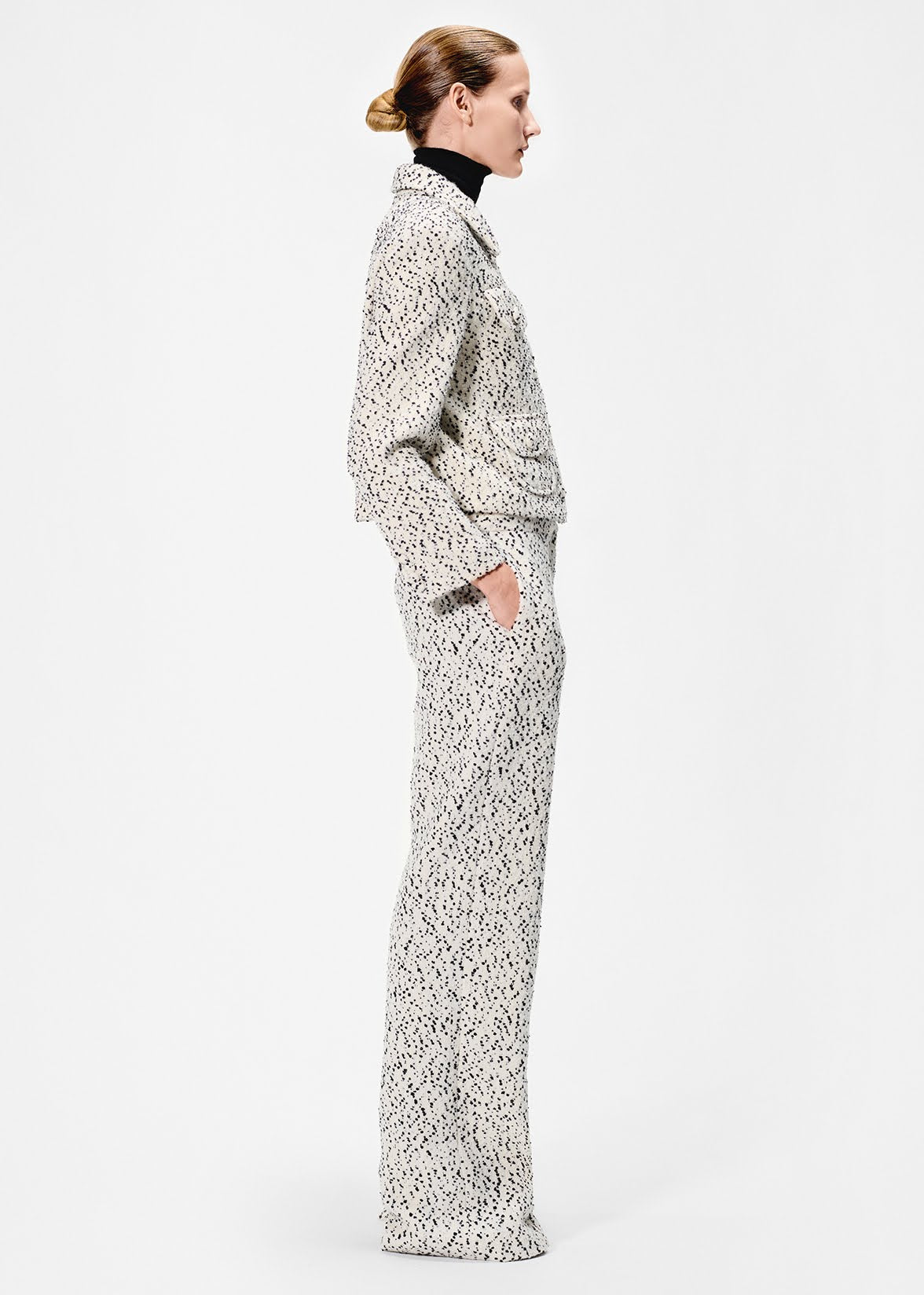 side view of model wearing the full leg trouser in salt and pepper tweed with the amos jacket