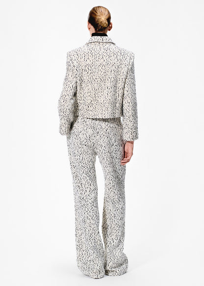 back view of model wearing the full leg trouser in salt and pepper tweed with the amos jacket