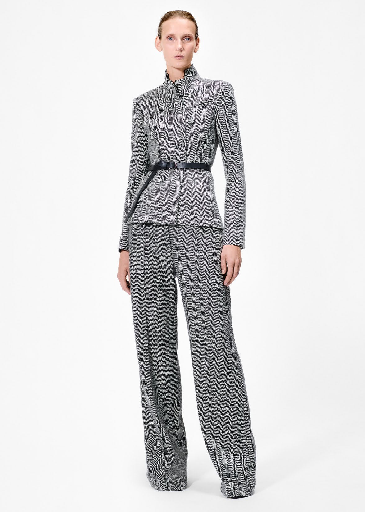 model wearing the full leg trouser in wool herringbone with the spencer jacket 