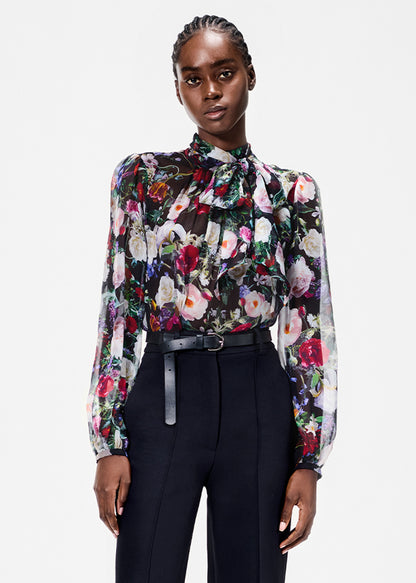 model wearing the joan blouse in printed chiffon in black floral 