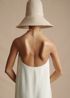 An image of the back of the Halter Dress in Printed Crepe, featuring the gold clasp closure.
