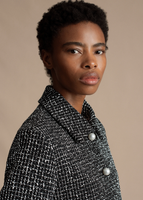 Close up side profile of model wearing the Cropped Marseille Jacket in Corded Tweed.