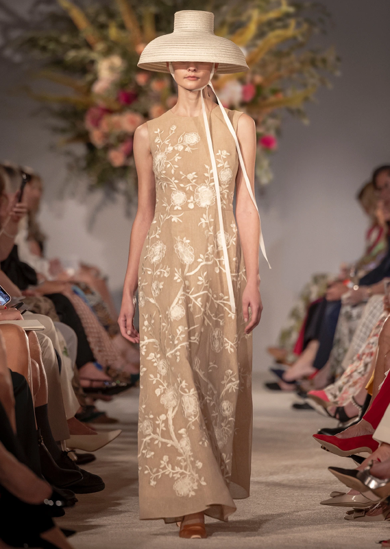 A model facing forward, walking down the Spring 2024 Runway wearing the Embroidered Eloise Dress in Cotton Burlap by Adam Lippes