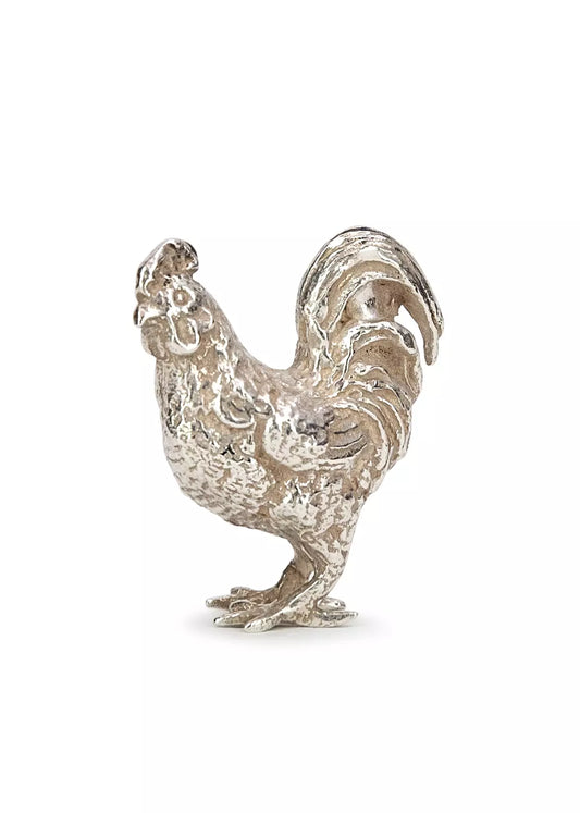 Photo of a sterling silver cockerel figure.