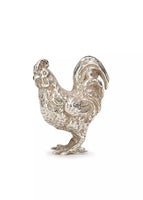 Photo of a sterling silver cockerel figure.