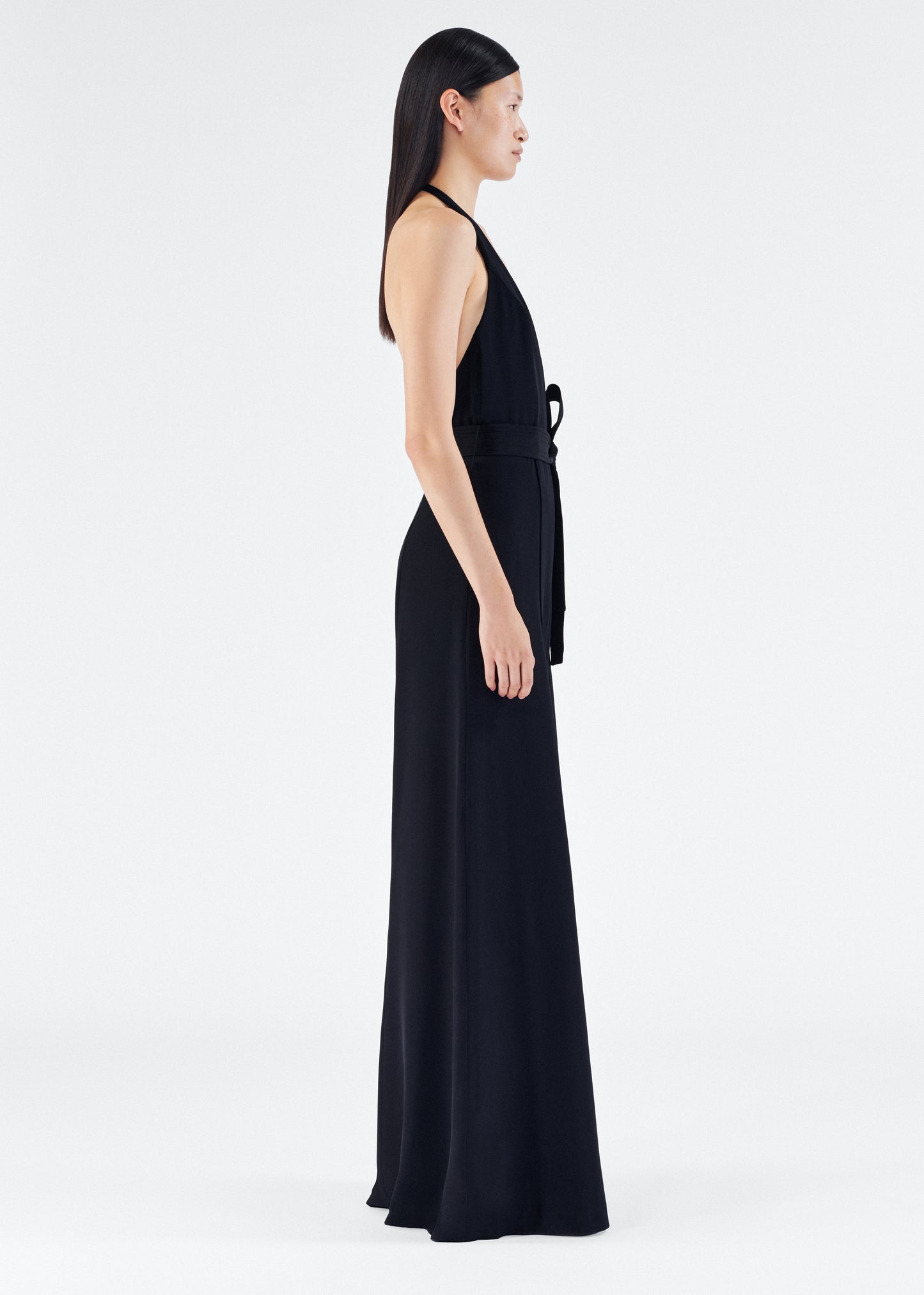 Model is wearing the Gaia Jumpsuit in Silk Crepe in Black