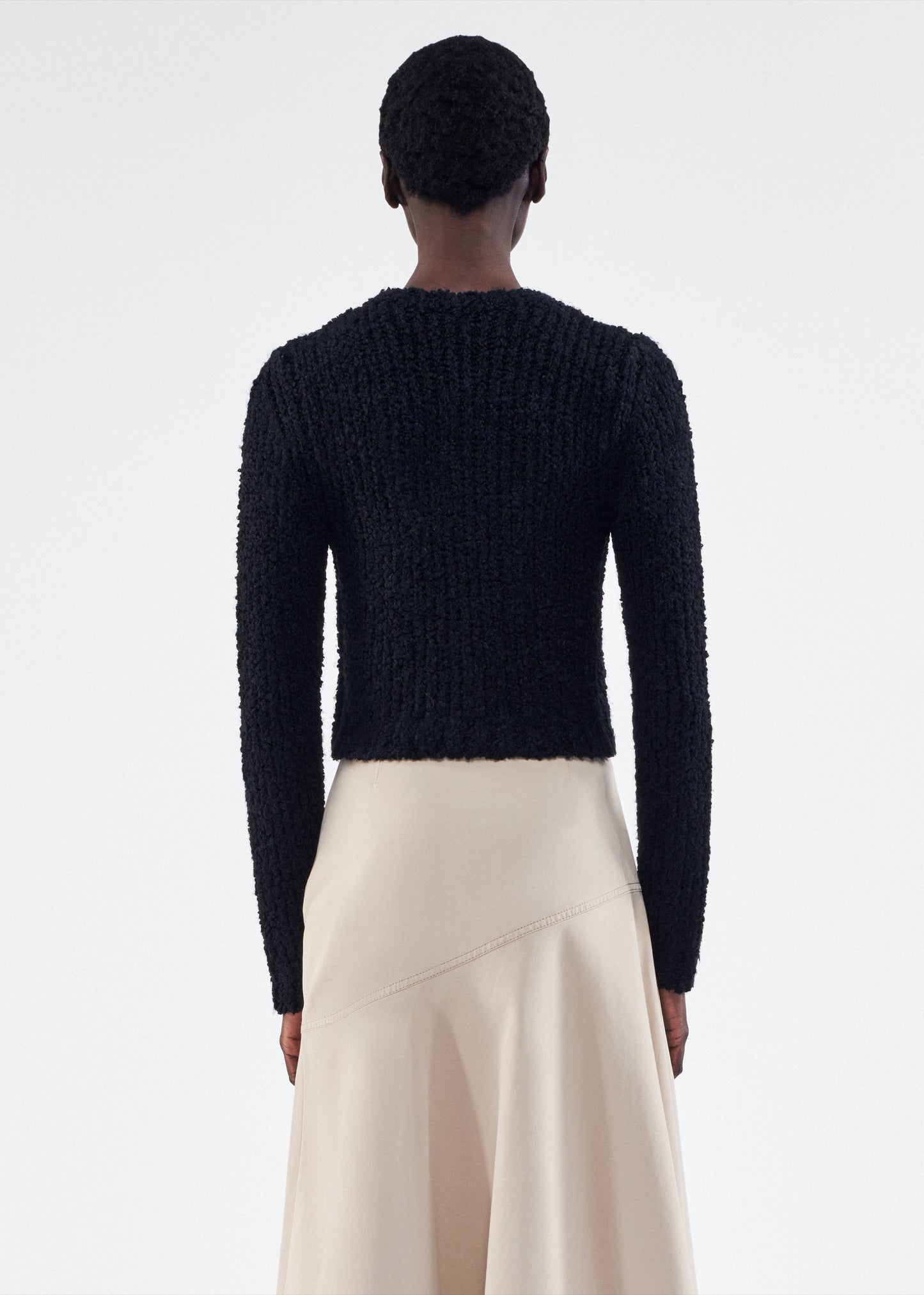 Back of model is wearing the Alice Cardigan in Mulberry Silk in Black