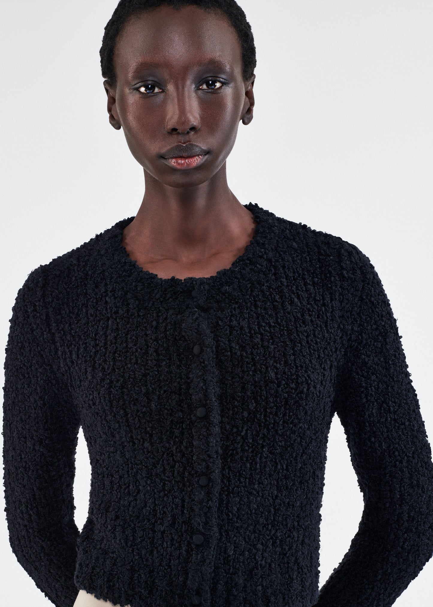 Close up of model wearing the Alice Cardigan in Mulberry Silk in Black