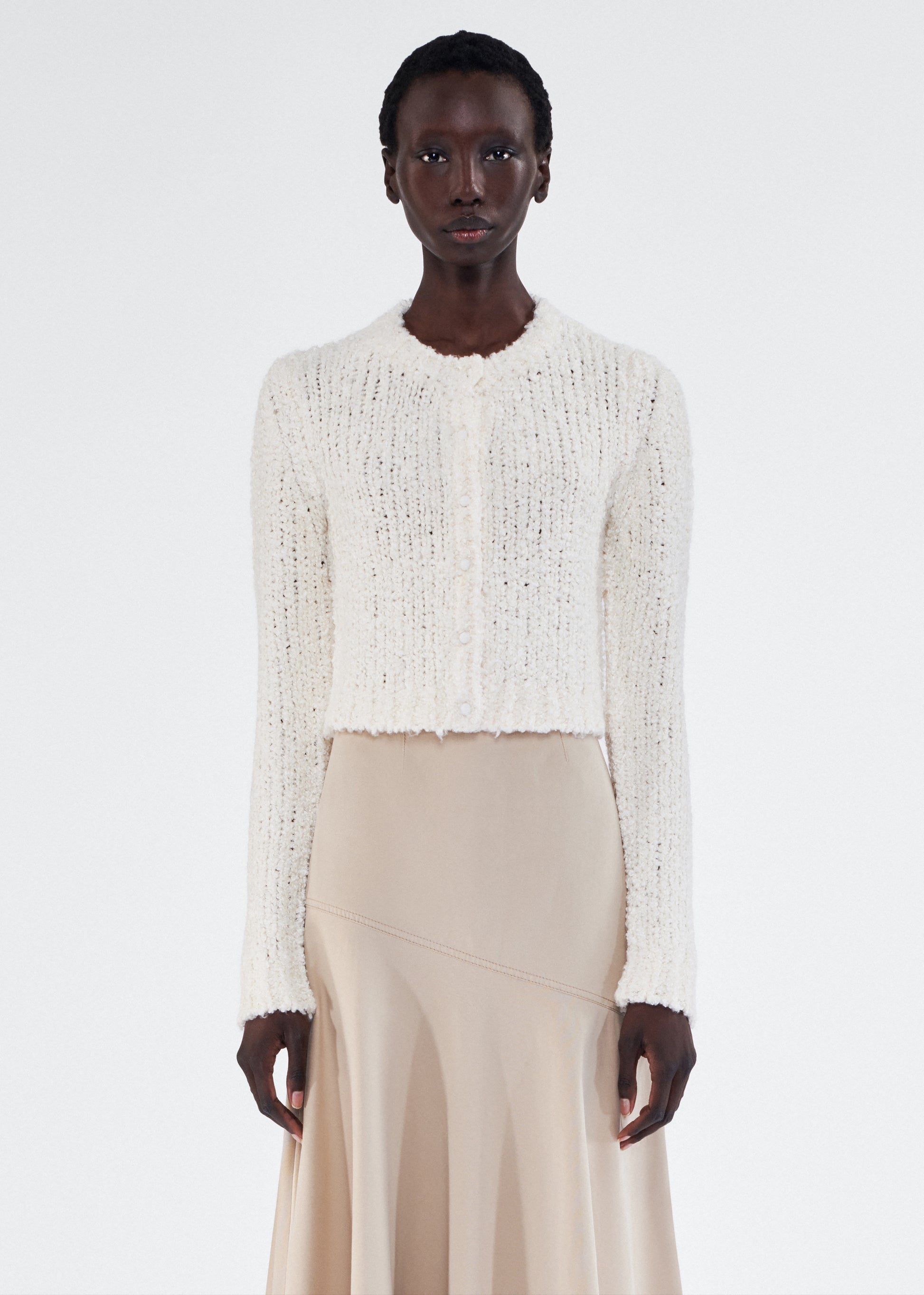 Front of model wearing the Alice Cardigan in Mulberry Silk in Ivory