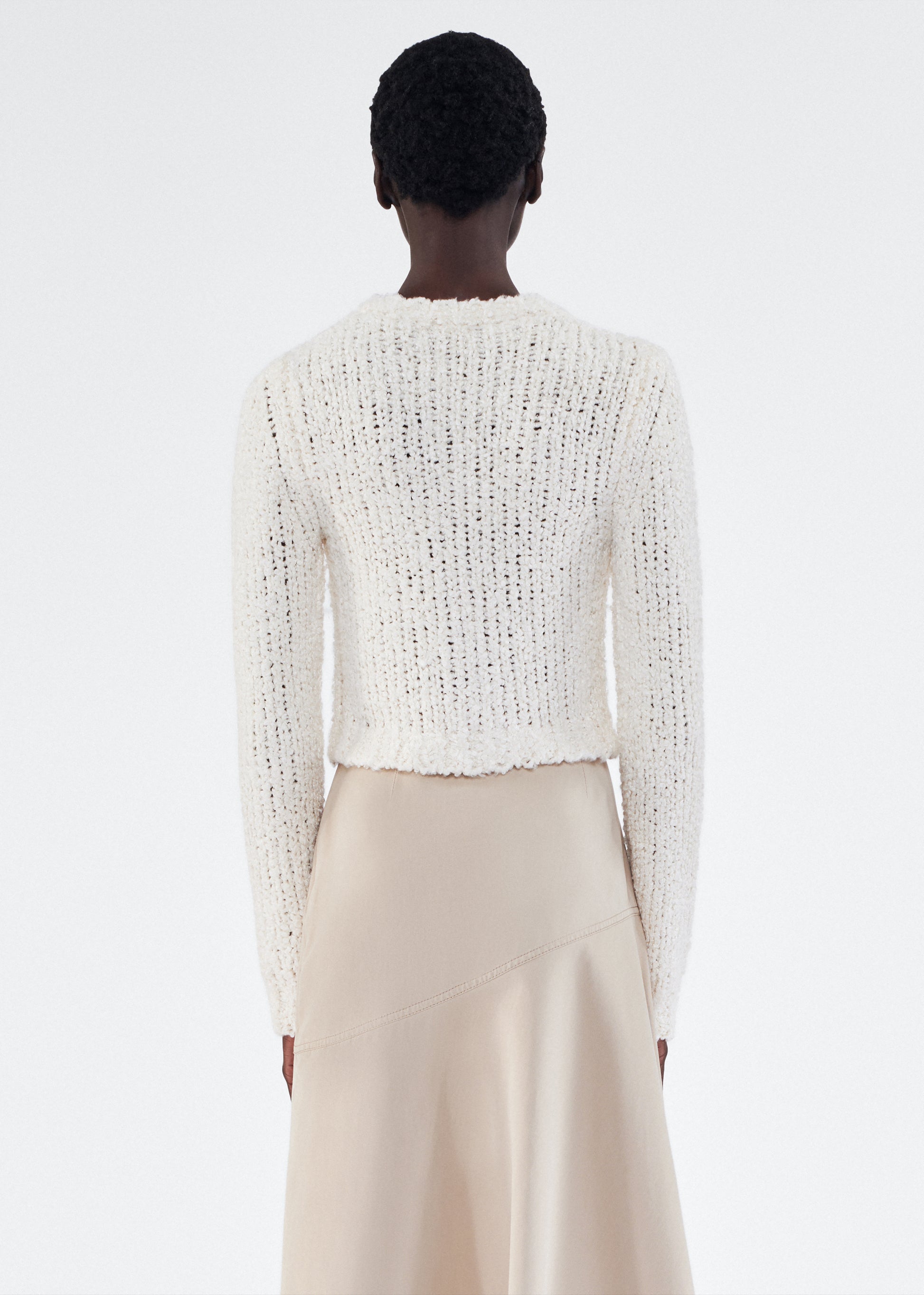 Back of model wearing the Alice Cardigan in Mulberry Silk in Ivory