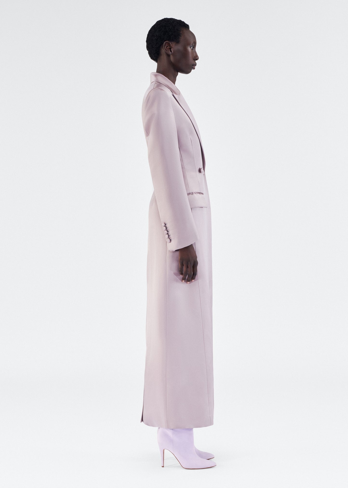 side view of model wearing laurence coat by adam lippes in duchess satin in smokey amethyst